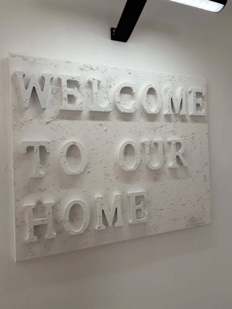 Welcome to Our Home, a handcrafted lettering canvas, 55.8 x 45.7 cm